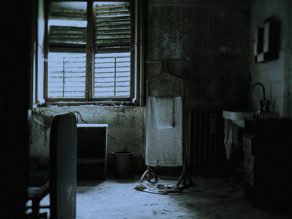 A council house-clearance job in outer London, chosen because the trade runs on strangers finishing what a dead stranger left behind, no questions asked.